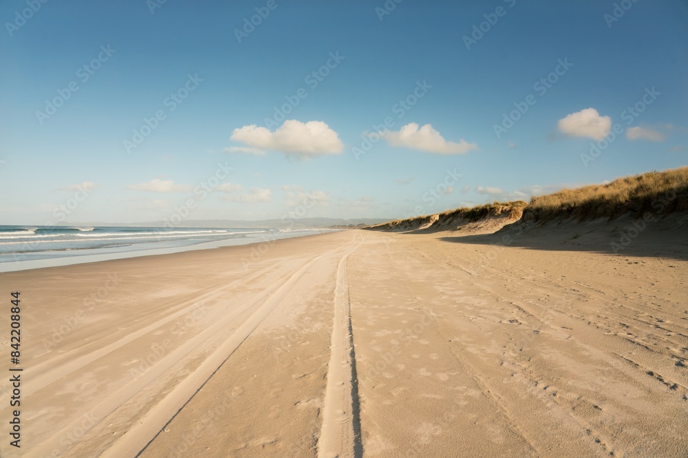 vehicle tracks on the beach, road on the beach, vehicle tracks on the beach, road on the beach,