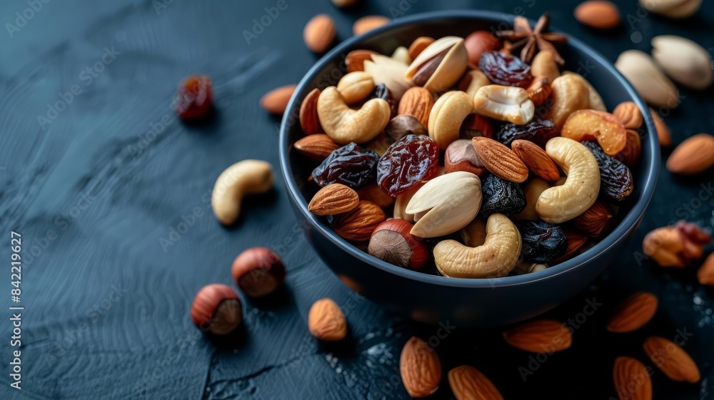A bowl of mixed nuts and dried fruits, perfect for a healthy snack on the go A bowl of mixed nuts and dried fruits, perfect for a healthy snack on the go