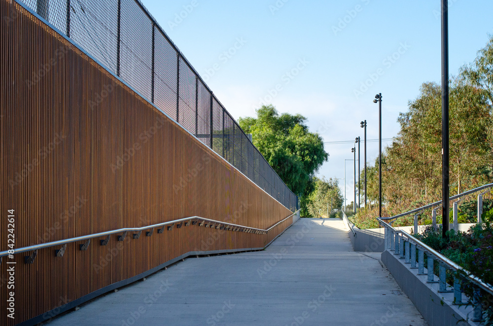 Urban walkway, equipped with accessible ramp, offers convenient ...