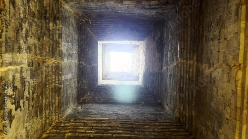 Looking up the inside of an ancient temple tower. East Mebon Temple ruins in the Angkor Wat archaeological complex. Khmer civilization. Siem Reap, Cambodia. photo