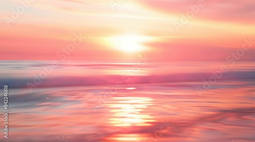 A dreamy  blurry photo capturing the red sky at morning above the ocean. The sun is setting  painting the sky in shades of orange and red  creating a beautiful natural landscape AIG50
