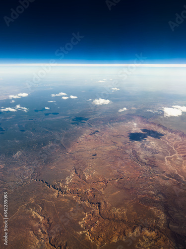 Areal view from a plane of arid Arizona landscape with clear blue sky