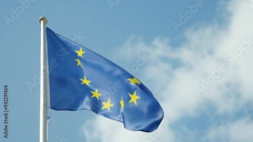 Waving European Union Flag Against a Blue Sky, Symbolic and Patriotic Footage in Vibrant Colors