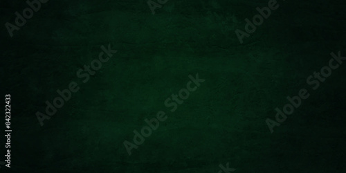 Dark green background texture, old vintage charcoal black backdrop paper with watercolor. Abstract background with green wall surface, black stucco texture. Black and green texture luxurious. © MdLothfor