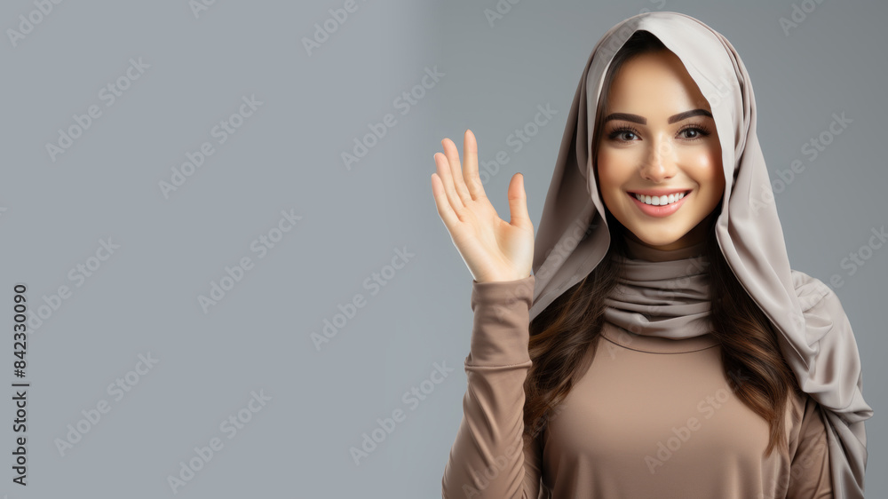 Arabian woman smile in casual apparel with welcome gesture greeting isolated Arabian woman smile in casual apparel with welcome gesture greeting isolated