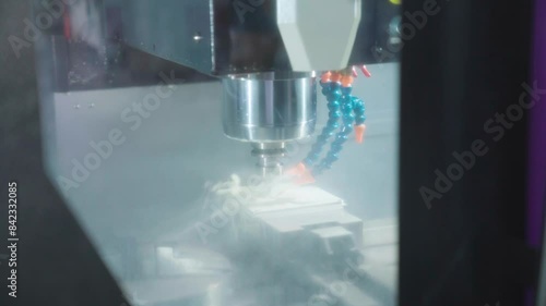 Non Contact Tonometry or NCT Chipping Machine with oil cooled spindle at work carving resign.