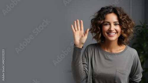 Latin woman smiling in casual apparel with welcome gesture greeting isolated © pariketan