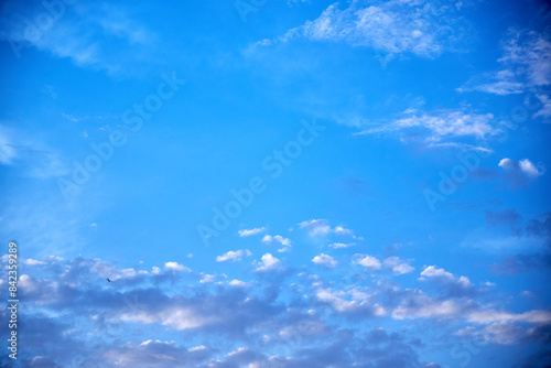 view of the blue sky at sunset with pink clouds