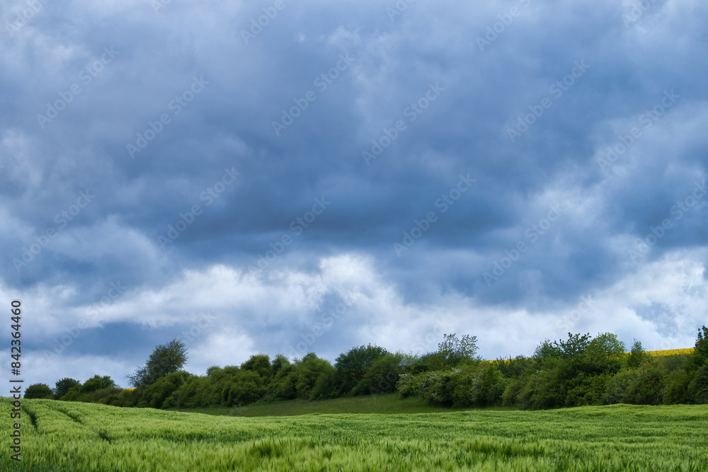Storm clouds on a spring evening near the village of Lohnsfeld, Germany. Storm clouds on a spring evening near the village of Lohnsfeld, Germany.