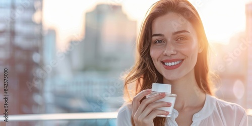 Beautiful young woman enjoying the sunset in the city