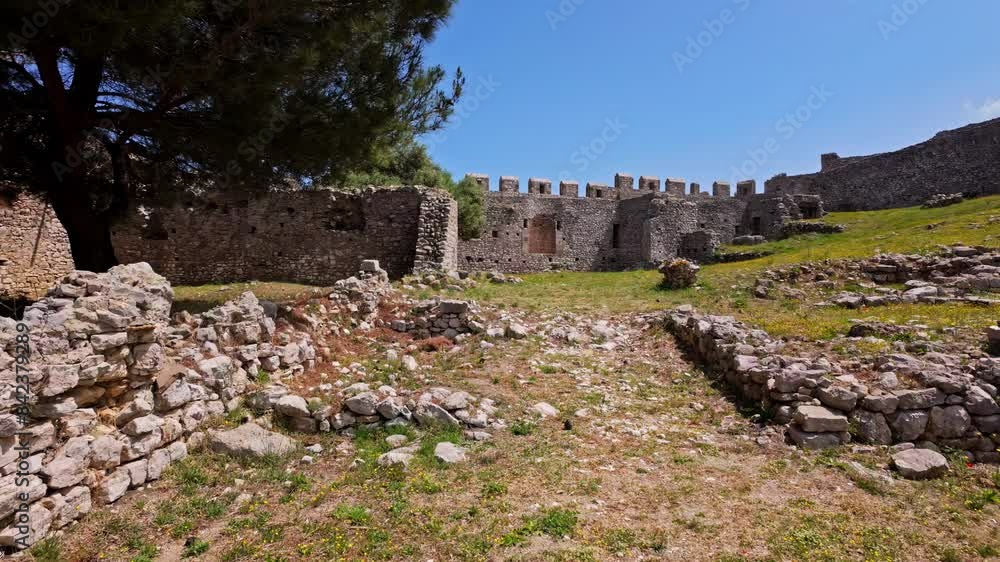 Old castle walls with remains in inner yard, dolly forward view Old castle walls with remains in inner yard, dolly forward view