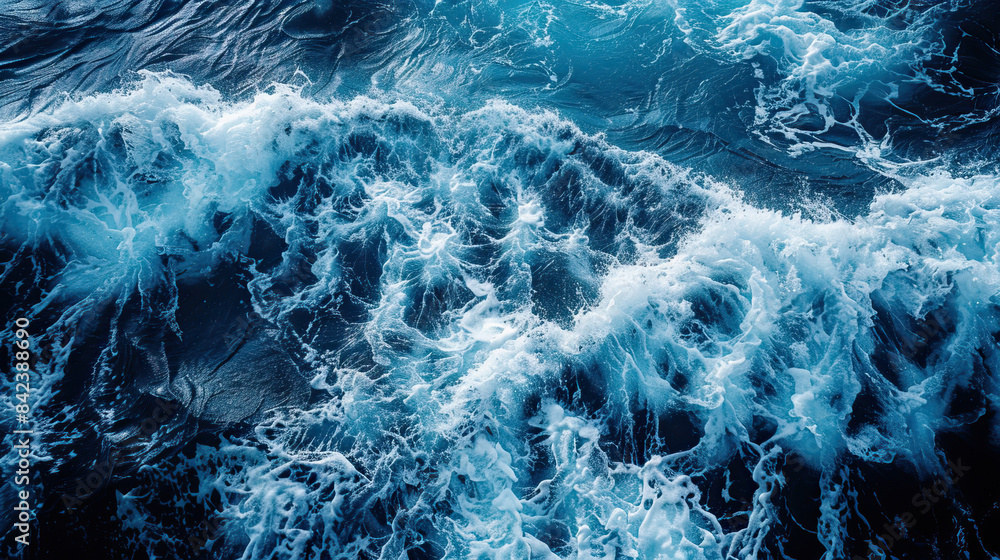 Close-up of a large ocean wave crashing against the shore, creating foam Close-up of a large ocean wave crashing against the shore, creating foam