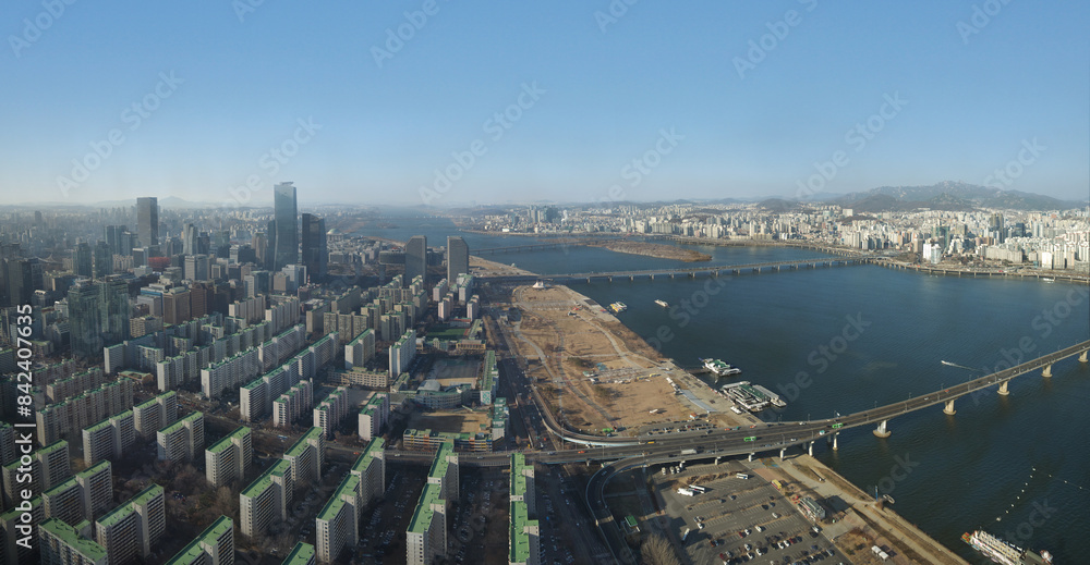 Obraz premium Seoul downtown aerial view with Han river, bridges and urban development residential area