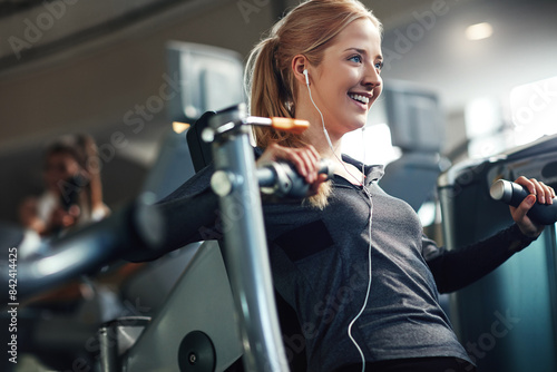 Billede på lærred Gym, woman and smile on chest press machine for workout to exercise for health, fitness and muscles