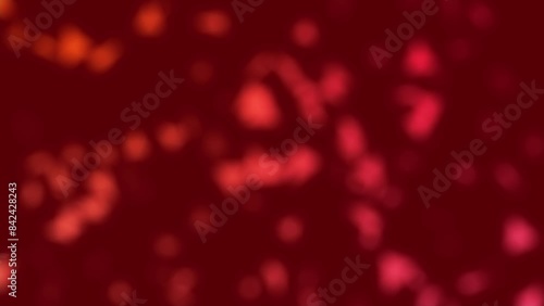 A background video that blurs the proliferation and movement of small red objects (like viruses, bacteria, pathogens, or cells). Seamless loop.