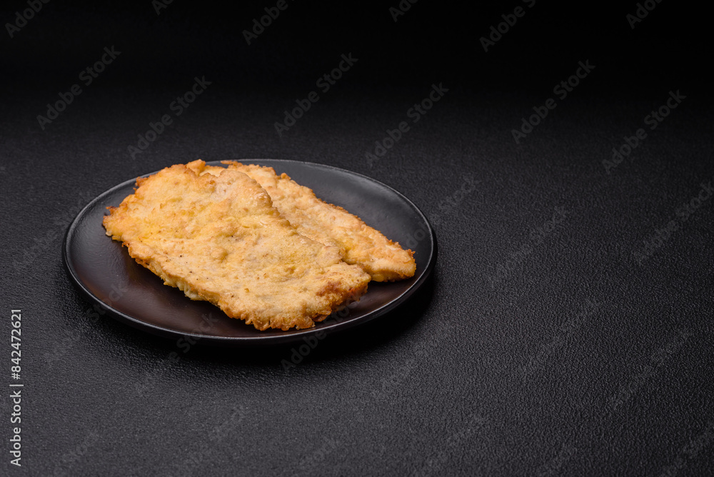 Delicious juicy chicken chops in batter with salt, spices and herbs Delicious juicy chicken chops in batter with salt, spices and herbs