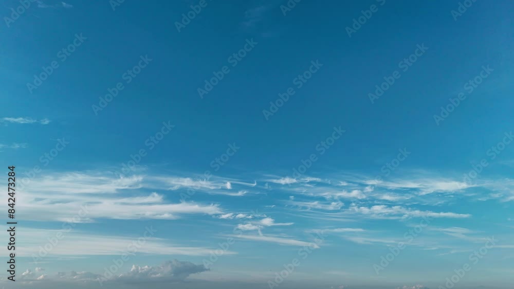 Wide panoramic view of a clear blue sky with thin, wispy clouds. Wide panoramic view of a clear blue sky with thin, wispy clouds.