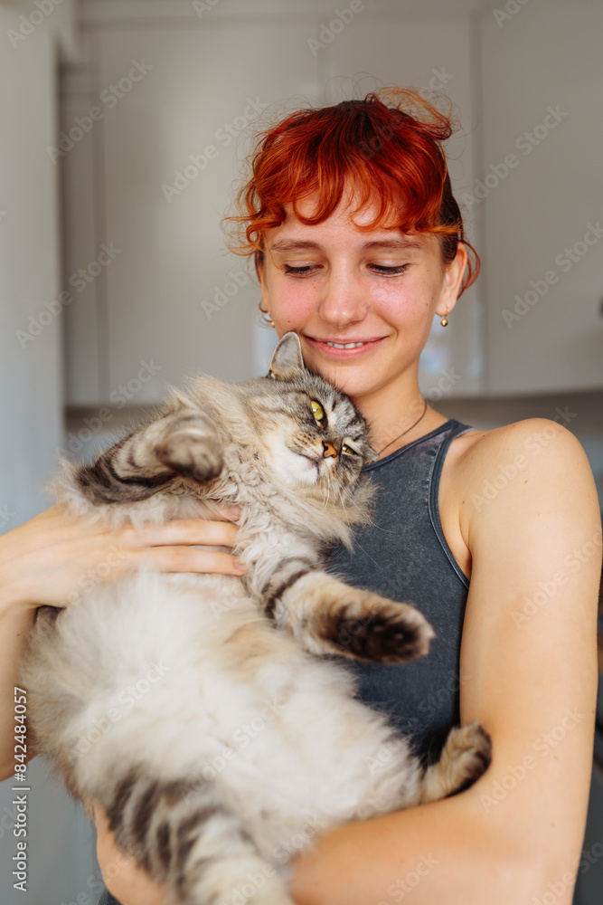 portrait red-haired teenage girl with gray fluffy cat portrait red-haired teenage girl with gray fluffy cat