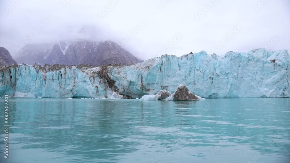 Glacier and Iceberg in Turquoise Sea Water, Alpefjord, Greenland