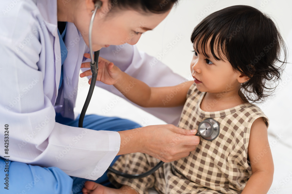 doctor using stethoscope to istening toddler's chest. baby health concept doctor using stethoscope to istening toddler's chest. baby health concept