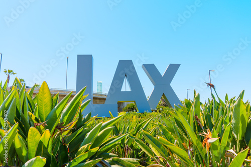 Los Angeles, California - April 8, 2024: LAX Airport Signage Amidst Verdant Greenery