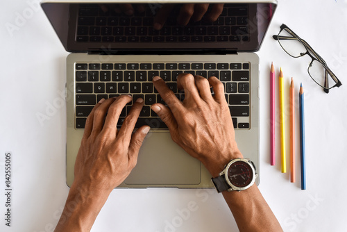 Asian man hand working with laptop flat lay view or from above shot