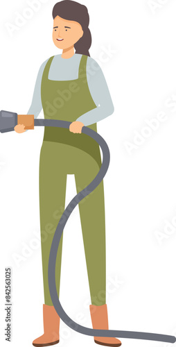Cheerful farmer is holding a large hose, preparing to water her crops
