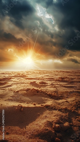 Sandy beach at sunset with ocean waves and sun rays. Summer and vacation concept. Design for poster, wallpaper, and greeting card, banner with copy space.