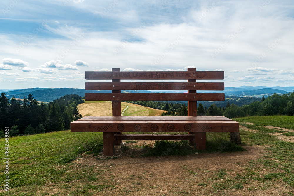 Big seat with beautful mountain scenery on the background on Kikula hill above Zwardon village on polish - slovakian borders Big seat with beautful mountain scenery on the background on Kikula hill above Zwardon village on polish - slovakian borders