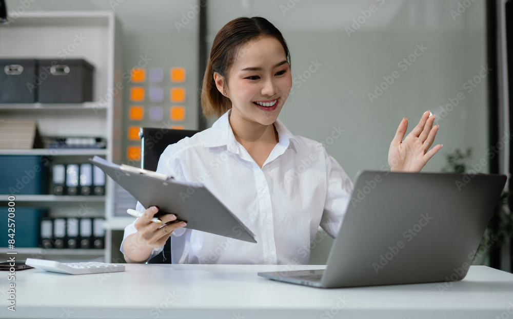 Successful business woman using smartphone and digital tablet, laptop computer in modern business office. Successful business woman using smartphone and digital tablet, laptop computer in modern business office.