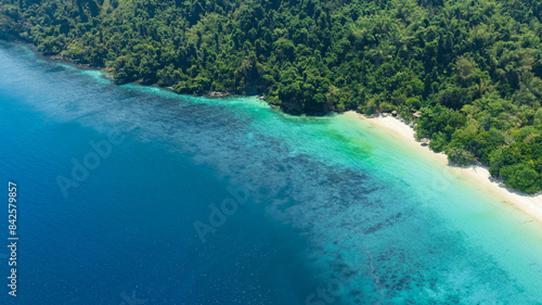 Aerial view of islands, Andaman Sea, natural blue waters and forests, tropical sea of Thailand. Beautiful scenery of the island with beautiful nature