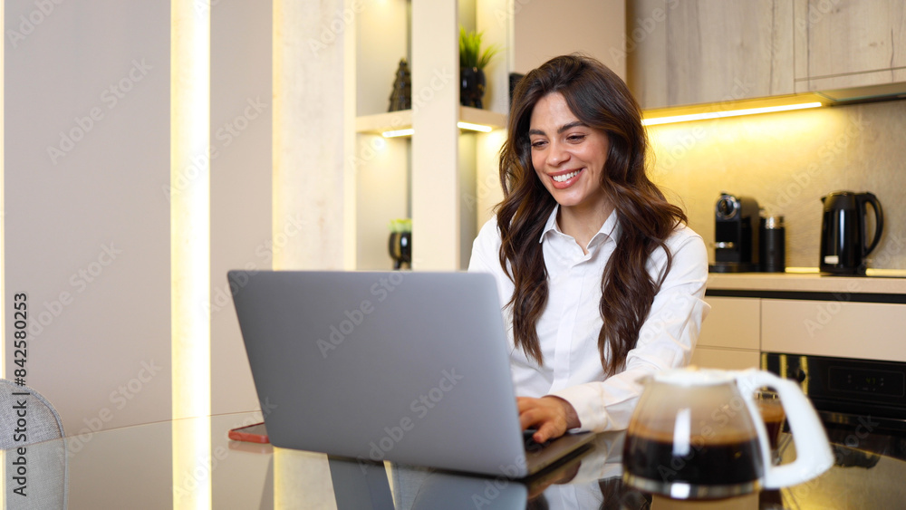 Beautiful, young businesswoman working online from home Beautiful, young businesswoman working online from home
