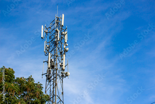 Telecommunication tower is a wireless communication technology in big cities on background sky photo