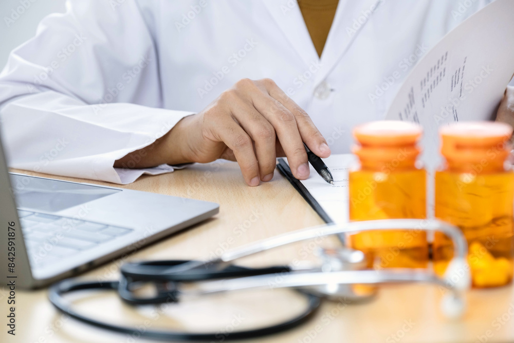 The female doctor sat and checked the patient's history and used a laptop to record patient information at the hospital. Medical concepts and interests The female doctor sat and checked the patient's history and used a laptop to record patient information at the hospital. Medical concepts and interests