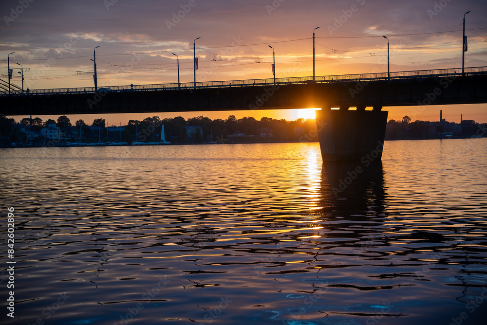 Obraz premium sunset over the river and a bridge