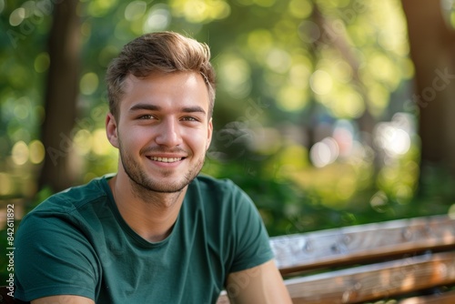 Casual man with short hair smiling at the park. Generative AI.