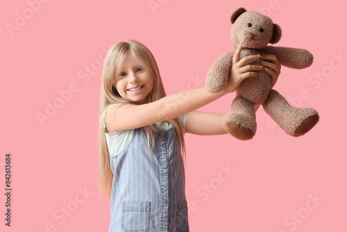 Cute little girl with plush...