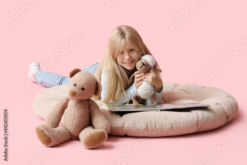 Cute little girl with plush...