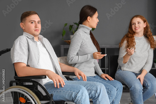 Young man in wheelchair at ...