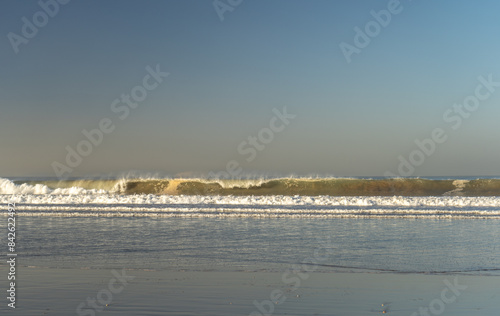 Sea Waves on Sandy Beach Texture Background, Ocean Water, Blue Sky, Summer Mockup © artemstepanov