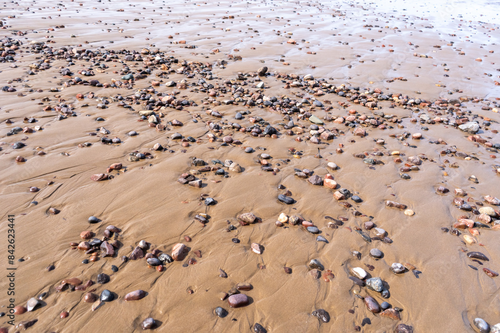 Colored Pebble Beach Texture Background, Sand and Rocky Shore Pattern, Red Morocco Beach, Africa Colored Pebble Beach Texture Background, Sand and Rocky Shore Pattern, Red Morocco Beach, Africa