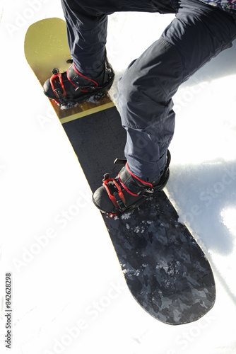 Male snowboarder on ski pis...
