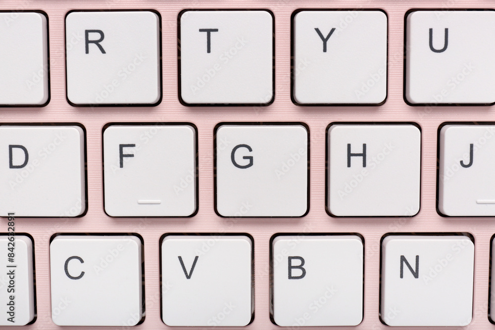 Buttons of pink computer keyboard. Closeup Buttons of pink computer keyboard. Closeup