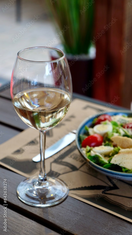 A festive table in a restaurant on a summer terrace with alcoholic drinks and meat and pork food A festive table in a restaurant on a summer terrace with alcoholic drinks and meat and pork food