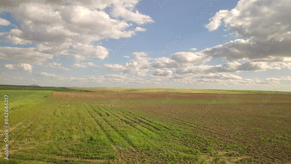 View of the landscape from the wind of a train traveling at great speed.. Traveling shot, cultivation grounds. View of the landscape from the wind of a train traveling at great speed.. Traveling shot, cultivation grounds.