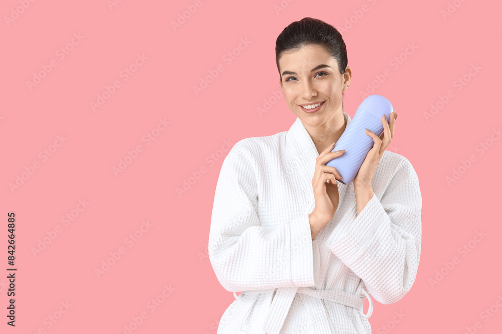 Beautiful young happy woman with liposoluble wax cartridge on pink background. Depilation concept Beautiful young happy woman with liposoluble wax cartridge on pink background. Depilation concept