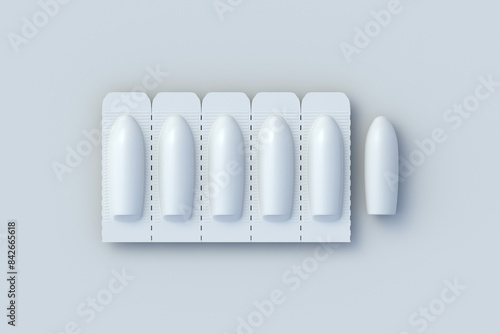 Closed and open suppositories for vaginal or anal use on gray background. Candles for treatment of hemorrhoids or inflammation. Medical suppositories. Pharmaceutical products. Top view. 3d render