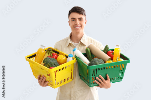 Young man with full shoppin...