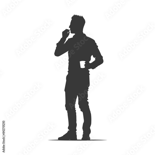 Silhouette of a man contemplating with coffee and a snack, full length.