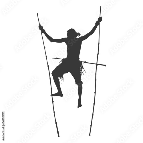 Silhouette: Indigenous Man Climbing Bamboo Poles, Traditional Ascension.